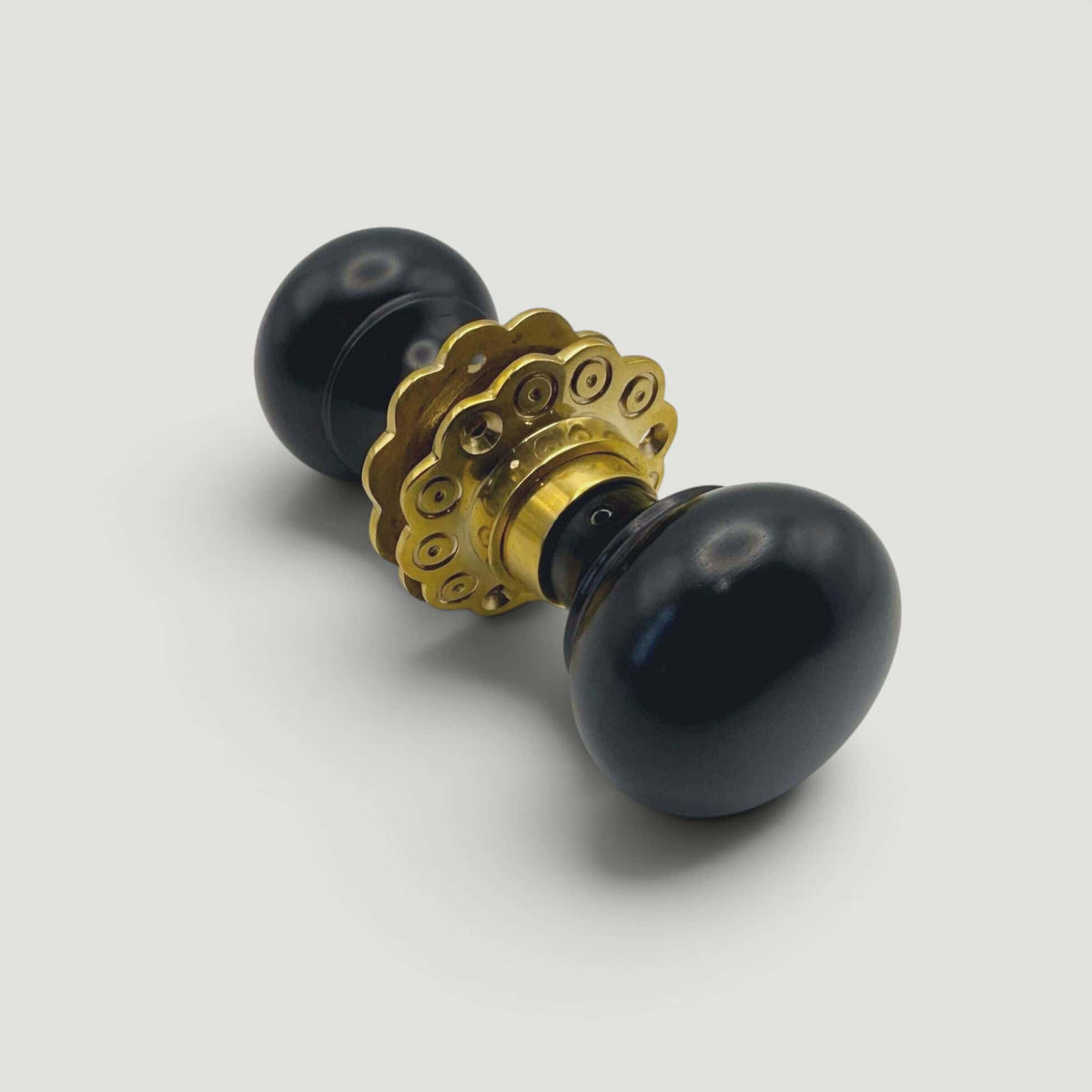 Ebony Bun Door Knob – Aged Brass