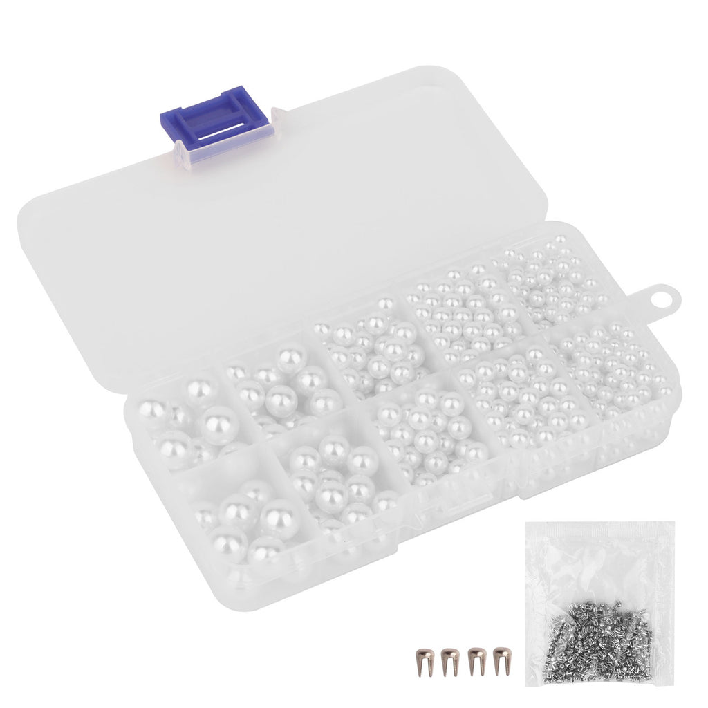 Assorted mixed-sized white beads with pins in a storage box